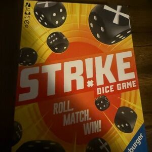 Ravensburger Strike Dice Game — Orange and Yellow Box with Black Dice
